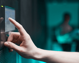Network engineers checking structured data cabling inside an enterprise server room enclosure