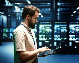 System administrator checking network analytics on a tablet