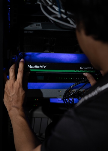 Cybernaut technician configuring a business VoIP phone system